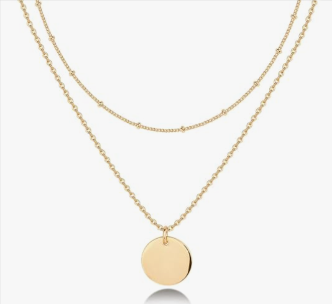 A dainty gold symbol pendant