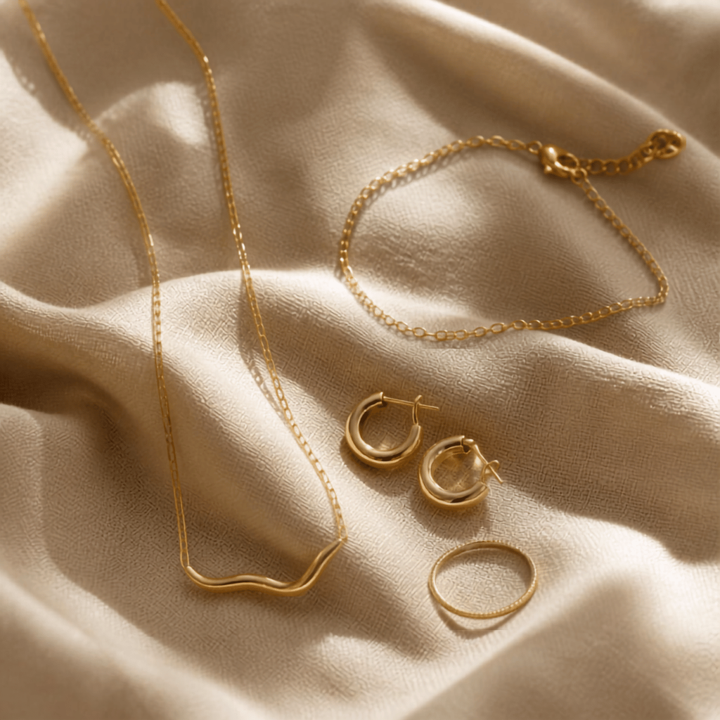 An assortment of affordable gold jewelry gifts under $100