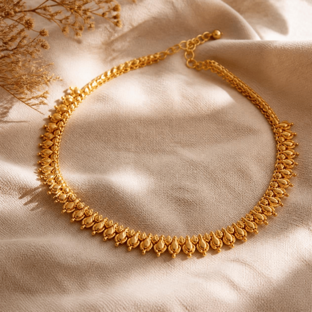 An elegant solid gold anniversary necklace on neutral linen